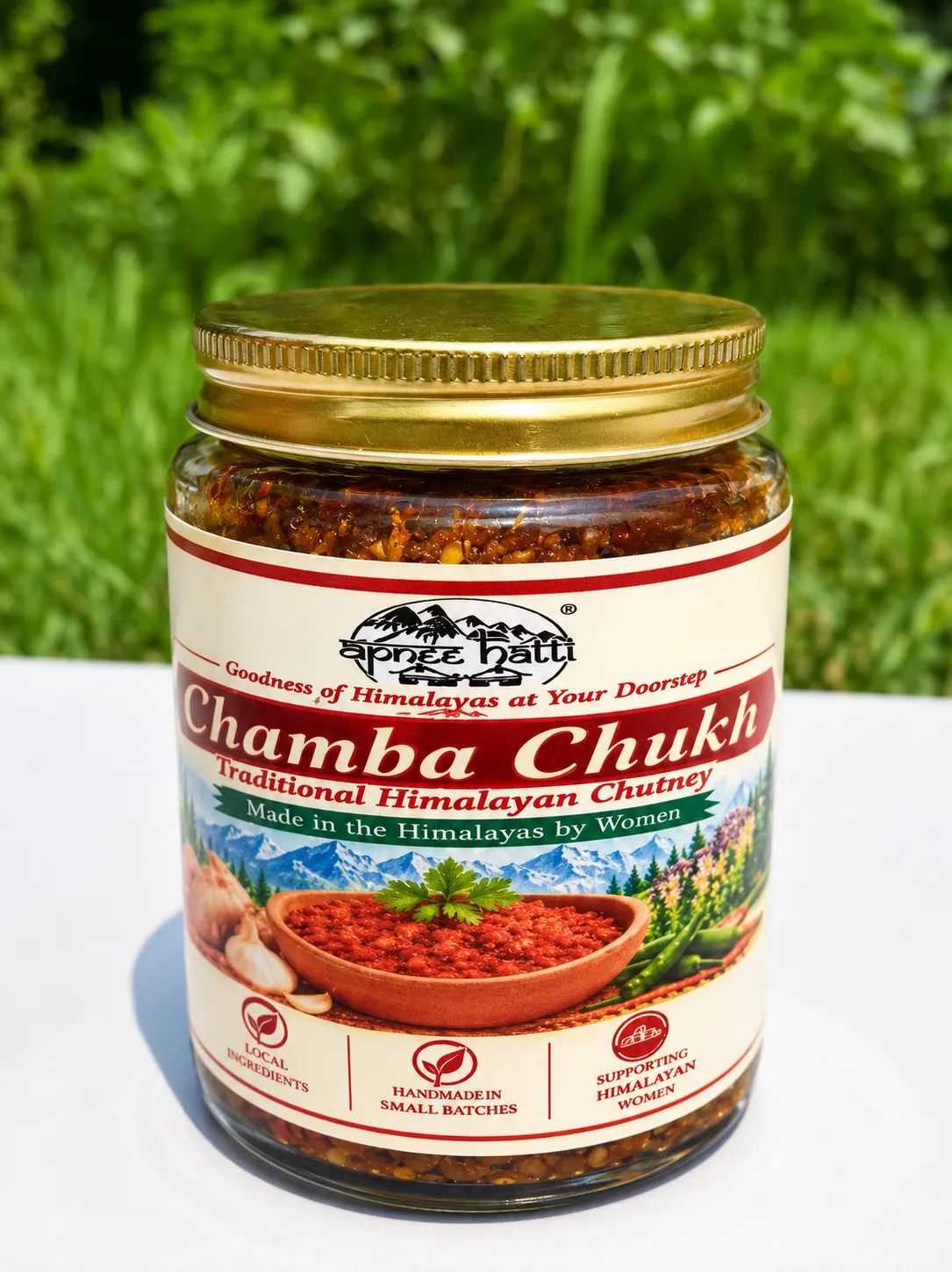 Apneehatti Chamba Chukh traditional Himalayan chilli chutney in a glass jar with a gold lid
